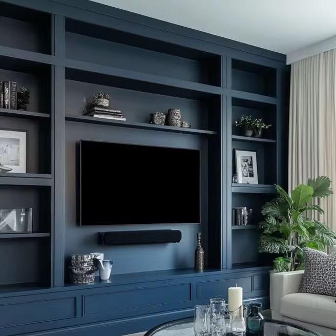 Deep navy built-ins, shelves around TV